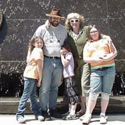 A photo of my immediate family including myself, my fiance, my two daughters, and my fiance's daughter.